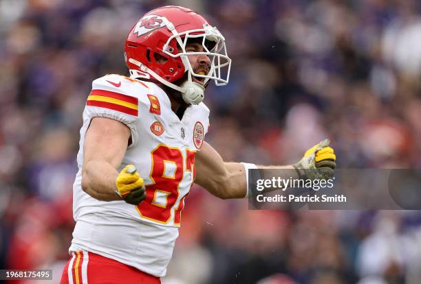 Travis Kelce of the Kansas City Chiefs reacts after catching a pass for a first down against the Baltimore Ravens during the first quarter in the AFC...