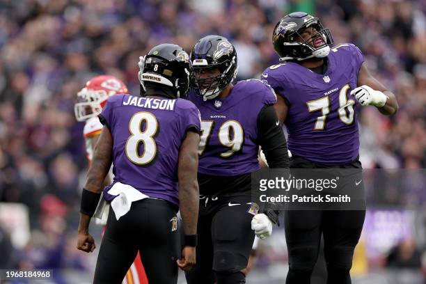 Lamar Jackson of the Baltimore Ravens celebrates with teammates after throwing a touchdown pass against the Kansas City Chiefs during the first...