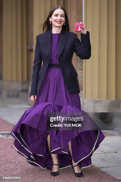 Serbian born fashion designer Roksanda Ilincic poses with their medal after being appointed a Member of the Order of the British Empire following an...