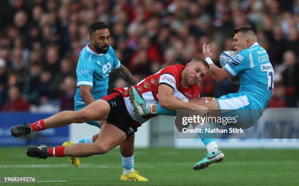 Joe Carpenter of Sale Sharks is tackled by Chris Harris of Gloucester Rugby during the Gallagher Premiership Rugby match between Gloucester Rugby and...