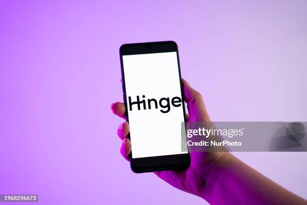 Person is holding a mobile phone with the Hinge dating app logo on its screen, in Athens, Greece, on 31 January 2024.