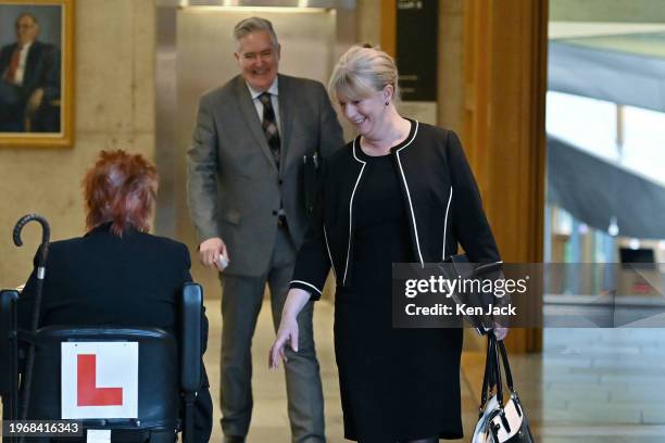 Deputy First Minister Shona Robison pauses to speak to fellow SNP MSP Christine Grahame on the way to the chamber of the Scottish Parliament for a...