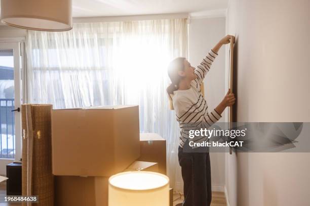 decorating new home - cat hanging stock pictures, royalty-free photos & images