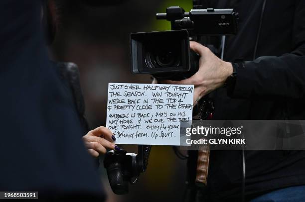 The cue card of Tottenham's own TV presenter is pictured as they work ahead of the English Premier League football match between Tottenham Hotspur...