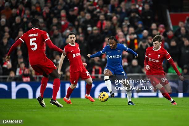 Chelsea's English midfielder Raheem Sterling controls the ball next to Liverpool's Northern Irish defender Conor Bradley , Liverpool's French...