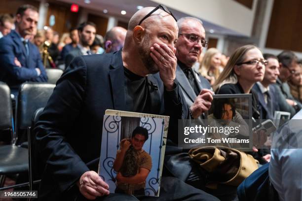 Sam Chapman, left, and Jaime Puerta, hold pictures of their sons Sammy Chapman, and Daniel Puerta-Johnson, who died of fentanyl poisoning from pills...