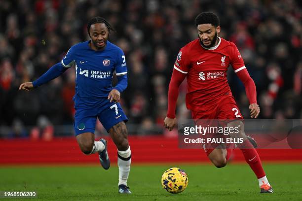 Chelsea's English midfielder Raheem Sterling fights for the ball with Liverpool's English defender Joe Gomez during the English Premier League...