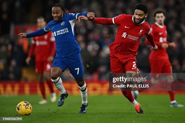 Chelsea's English midfielder Raheem Sterling fights for the ball with Liverpool's English defender Joe Gomez during the English Premier League...