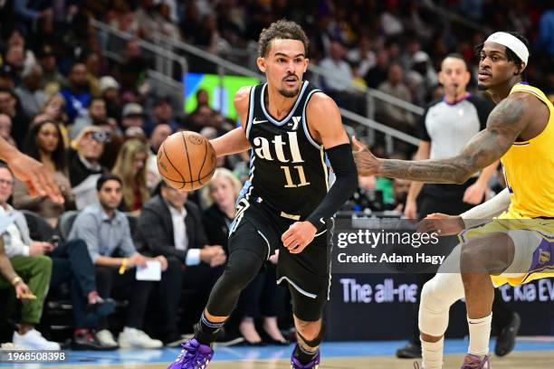 Trae Young of the Atlanta Hawks dribbles the ball during the game against the Los Angeles Lakers on January 30, 2024 at State Farm Arena in Atlanta,...