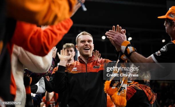 Adam Kowalski from the BR Volleys slaps hands with fans during the Volleyball Champions League match against Tours VB on January 31, 2024 in Berlin,...