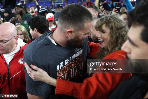 Travis Kelce of the Kansas City Chiefs celebrates with Taylor Swift after a 17-10 victory against the Baltimore Ravens in the AFC Championship Game...