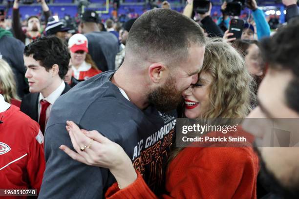 Travis Kelce of the Kansas City Chiefs celebrates with Taylor Swift after a 17-10 victory against the Baltimore Ravens in the AFC Championship Game...