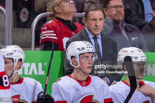 Head coach Jacques Martin of the Ottawa Senators watches the action from the bench against the Detroit Red Wings during the second period at Little...