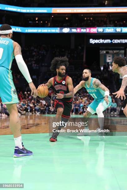 Coby White of the Chicago Bulls dribbles the ball during the game against the Charlotte Hornets on January 31, 2024 at Spectrum Center in Charlotte,...