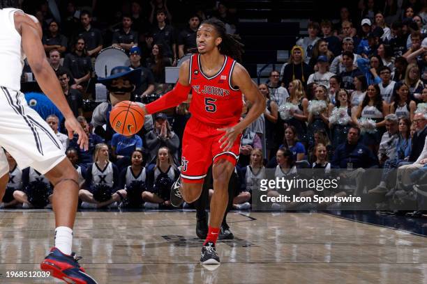 St. John's Red Storm guard Daniss Jenkins brings the ball up court during a college basketball game against the Xavier Musketeers on January 31, 2024...