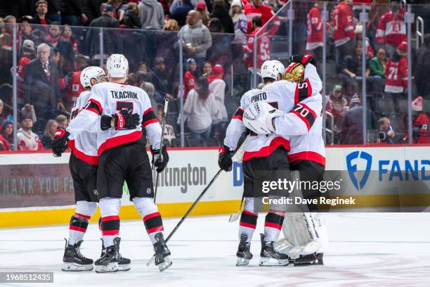 Shane Pinto of the Ottawa Senators scores the game winning goal in O.T. On Alex Lyon of the Detroit Red Wings and celebrates with teammates at Little...