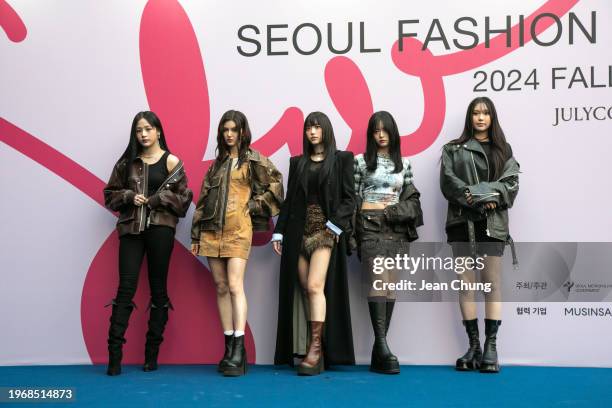 Minji, Danielle, Hearin, Hanni, and Hyein, members of New Jeans, a K-pop girl band, take a pose during a photo call for JULYCOLUMN at Seoul Fashion...