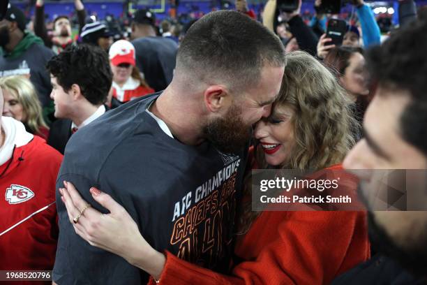 Travis Kelce of the Kansas City Chiefs celebrates with Taylor Swift after a 17-10 victory against the Baltimore Ravens in the AFC Championship Game...