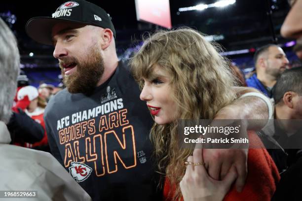 Travis Kelce of the Kansas City Chiefs celebrates with Taylor Swift after a 17-10 victory against the Baltimore Ravens in the AFC Championship Game...