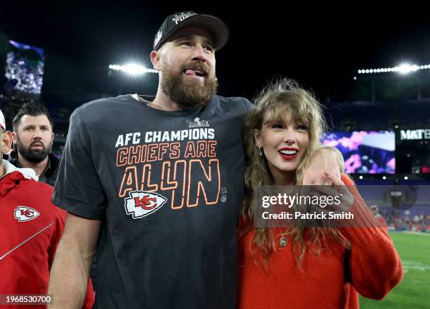 Travis Kelce of the Kansas City Chiefs celebrates with Taylor Swift after a 17-10 victory against the Baltimore Ravens in the AFC Championship Game...