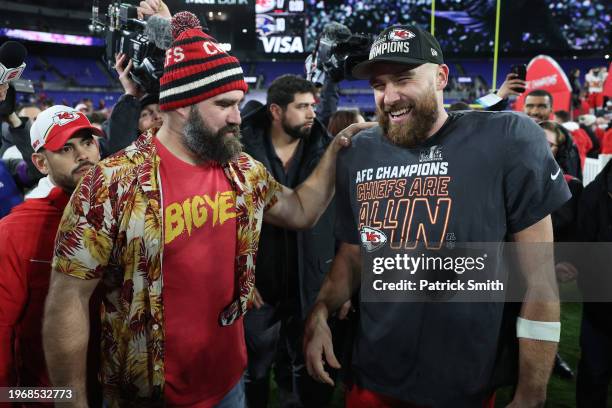 Travis Kelce of the Kansas City Chiefs celebrates with his brother Jason Kelce after a 17-10 victory against the Baltimore Ravens in the AFC...