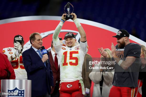 Patrick Mahomes of the Kansas City Chiefs celebrates with the Lamar Hunt Trophy after a 17-10 victory against the Baltimore Ravens in the AFC...
