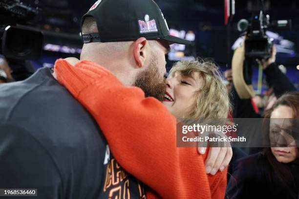 Travis Kelce of the Kansas City Chiefs celebrates with Taylor Swift after a 17-10 victory against the Baltimore Ravens in the AFC Championship Game...