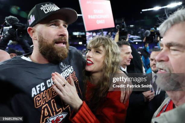 Travis Kelce of the Kansas City Chiefs celebrates with Taylor Swift after a 17-10 victory against the Baltimore Ravens in the AFC Championship Game...