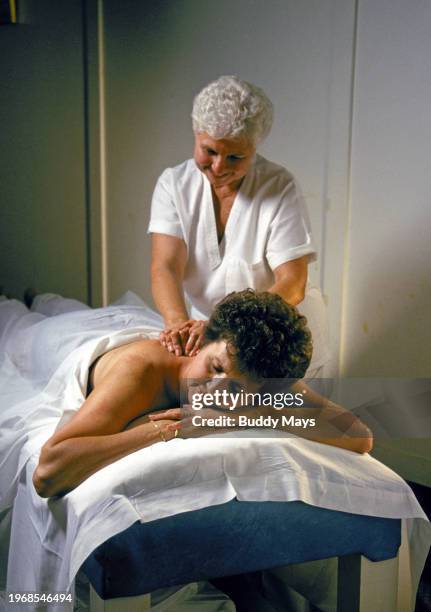 Woman receives a massage at one of the historic bath houses along Bath House Row in Hot Springs National Park, Arkansas, 1995. .