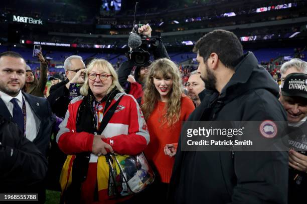 Taylor Swift is seen on the field with Donna Kelce, mother of Travis Kelce of the Kansas City Chiefs after the Chiefs' 17-10 victory against the...
