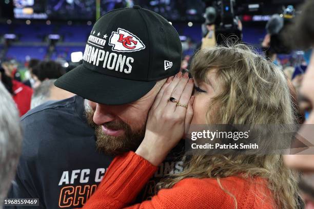 Travis Kelce of the Kansas City Chiefs celebrates with Taylor Swift after a 17-10 victory against the Baltimore Ravens in the AFC Championship Game...