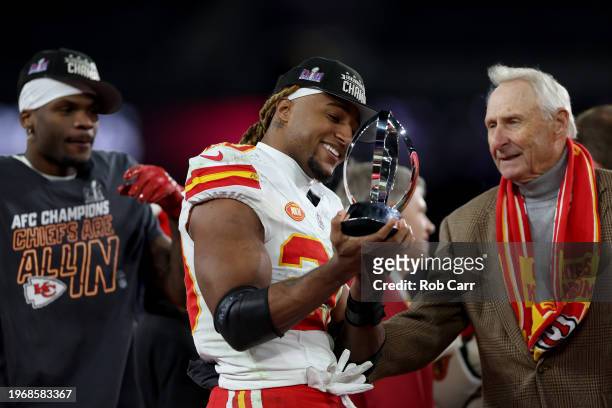 Justin Reid of the Kansas City Chiefs celebrates with the Lamar Hunt Trophy after a 17-10 victory against the Baltimore Ravens in the AFC...