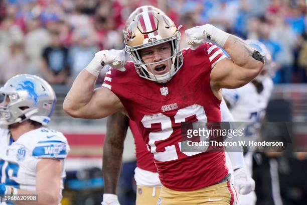 Christian McCaffrey of the San Francisco 49ers celebrates after scoring a touchdown during the second quarter against the Detroit Lions in the NFC...
