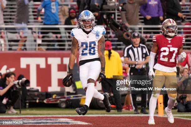 Jahmyr Gibbs of the Detroit Lions reacts after running the ball for a touchdown during the second quarter against the San Francisco 49ers in the NFC...