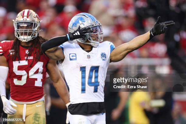 Amon-Ra St. Brown of the Detroit Lions reacts after catching a pass for a first down during the second quarter against the San Francisco 49ers in the...