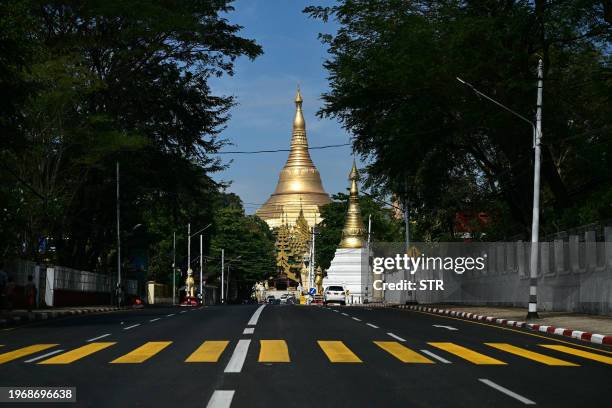 An almost empty street in pictured near the Shwe Dagon Pagoda during a "silent strike" to protest and to mark the third anniversary of the military...