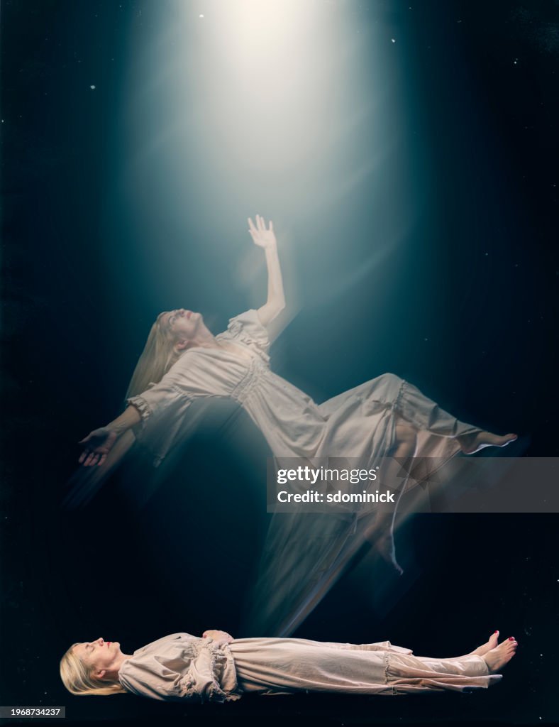 Woman Experiencing Astral Projection as Her Spirit body Floats Toward Light
