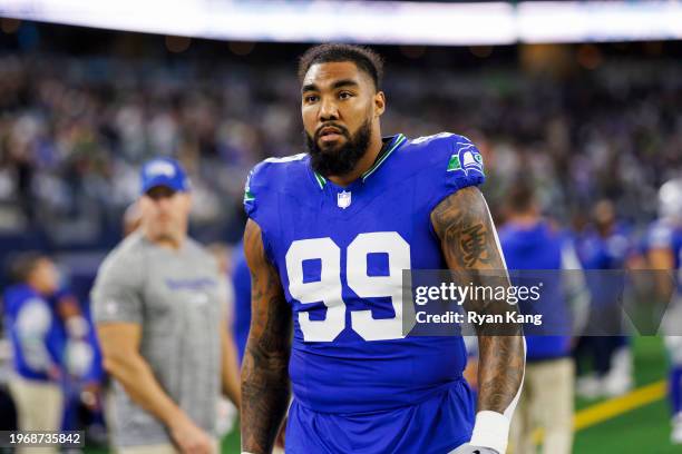 Leonard Williams of the Seattle Seahawks looks on from the sideline before an NFL football game against the Dallas Cowboys at AT&T Stadium on...