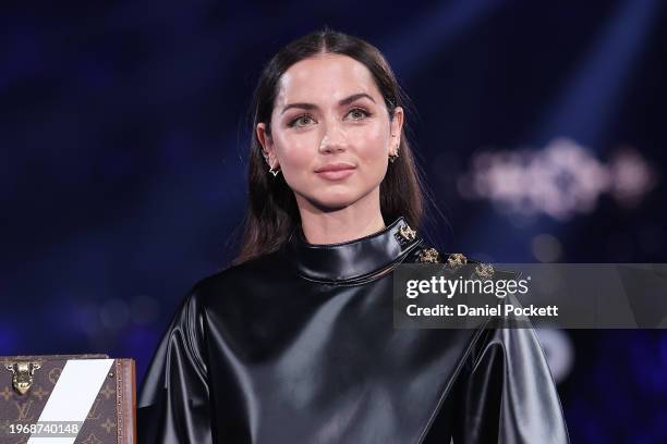 Ana de Armas looks on as The Norman Brookes Challenge Cup arrives in the Louis Vuitton trophy trunk, prior to the Men's Singles Final match between...