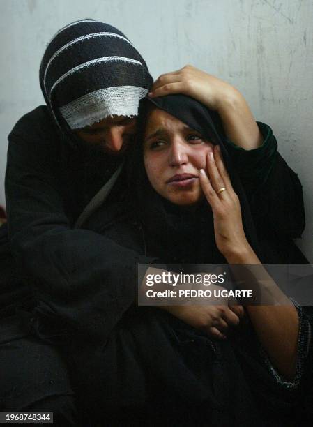 Manal, wife of Palestinian Osama al-Sneir, mourns the death of her husband in Deir al-Balah in the Gaza Strip 27 November 2003. Al-Sneiri was killed...