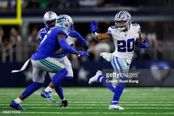 Tony Pollard of the Dallas Cowboys carries the ball on a run play during an NFL football game against the Seattle Seahawks at AT&T Stadium on...