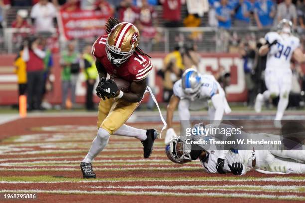 Brandon Aiyuk of the San Francisco 49ers catches a pass for a touchdown during the third quarter against the Detroit Lions in the NFC Championship...