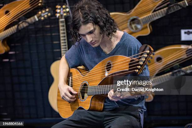 Visitor playing an instrument during The NAMM Show at Anaheim Convention Center on January 28, 2024 in Anaheim, California.