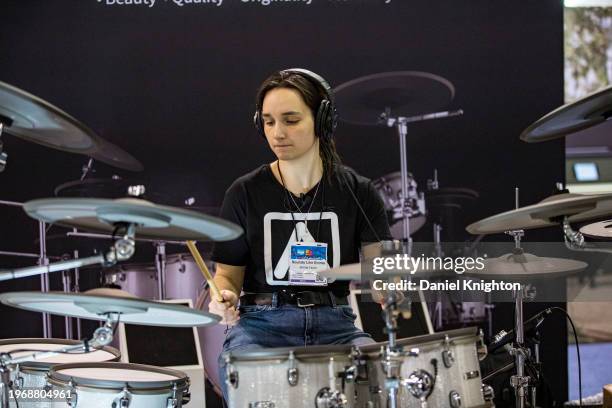 Visitor plays drums during The NAMM Show at Anaheim Convention Center on January 28, 2024 in Anaheim, California.