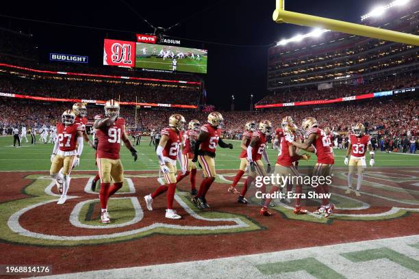 Arik Armstead of the San Francisco 49ers celebrates with teammates after recovering a fumble during the third quarter against the Detroit Lions in...