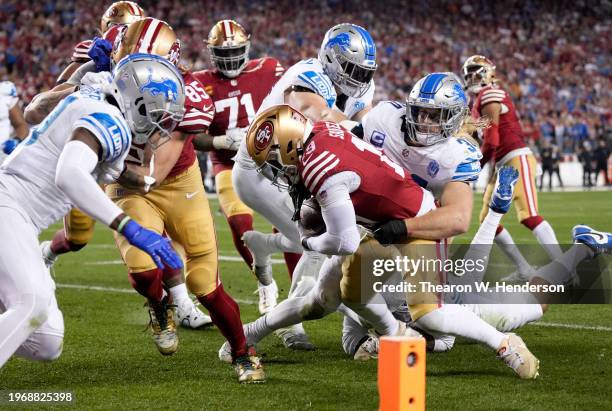 Deebo Samuel of the San Francisco 49ers is tackled by Alex Anzalone of the Detroit Lions during the third quarter in the NFC Championship Game at...