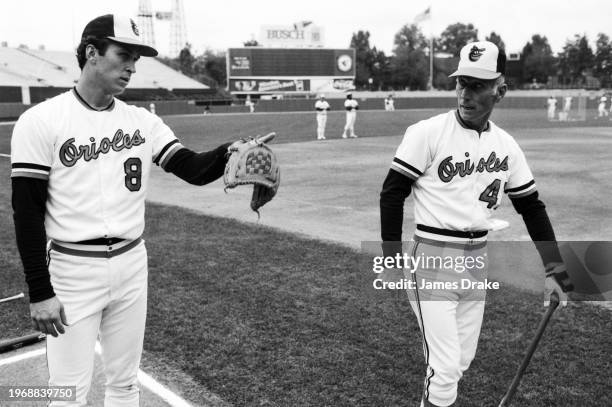 Baltimore Orioles short stop Cal Ripkin Jr. And third base coach Cal Ripken Sr. Talk during batting practice before Game 2 of the 1983 World Series...