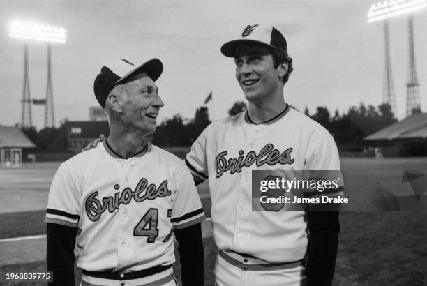 Baltimore Orioles third base coach Cal Ripkin Sr. And short stop Cal Ripken Jr. Talk during batting practice before Game 2 of the 1983 World Series...