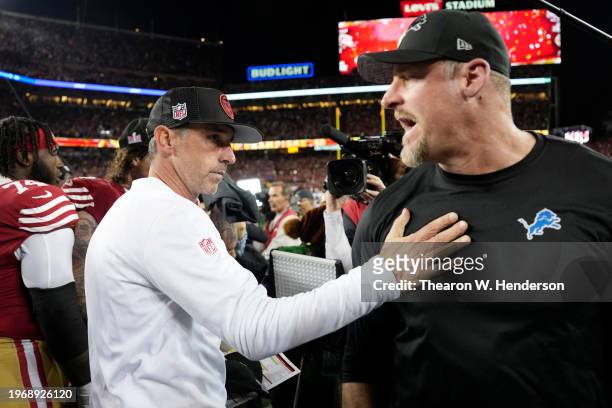 Head coach Kyle Shanahan of the San Francisco 49ers hugs Head coach Dan Campbell of the Detroit Lions following the NFC Championship Game at Levi's...