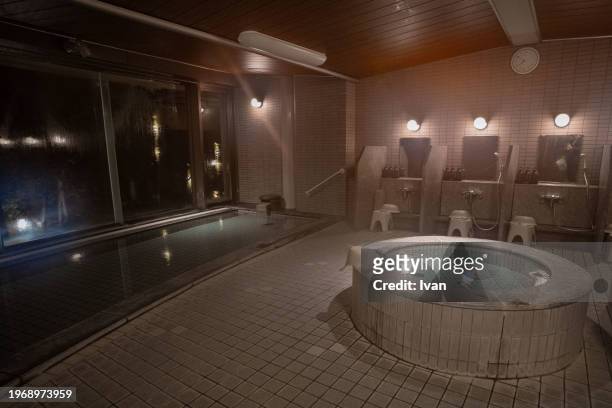 japanese indoor hot spring bath - miyajima stock pictures, royalty-free photos & images